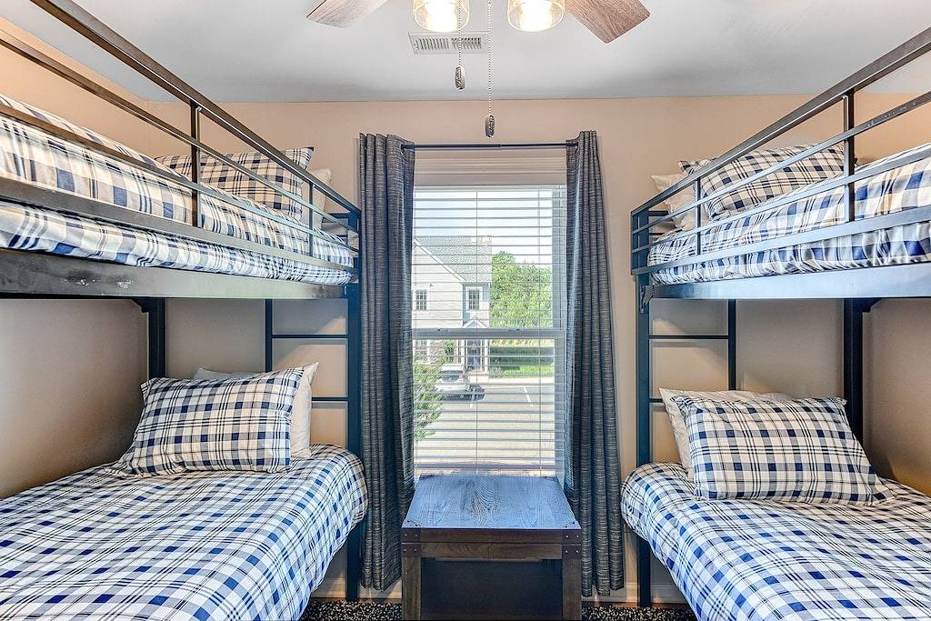 Three-story lakefront home w/ covered boat slip, and tennis/pickleball access in Lake Anna