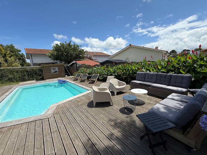 Maison de vacances pour 10 personnes, avec Terrasse ainsi que Jardin et Piscine dans Biscarrosse (bourg)