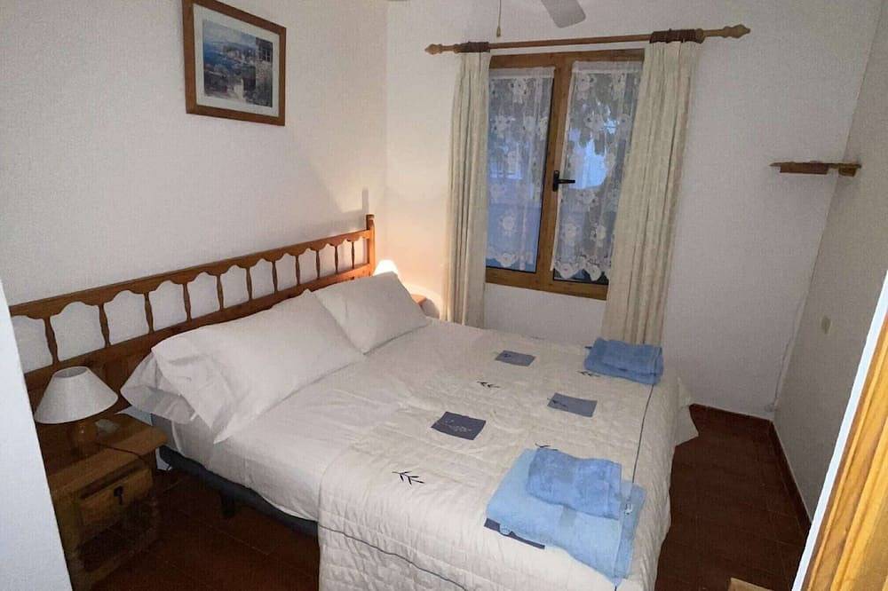 Apartamento entero, Apartamento con piscina, jardines compartidos y vistas al mar in Arenal d'en Castell, Es Mercadal