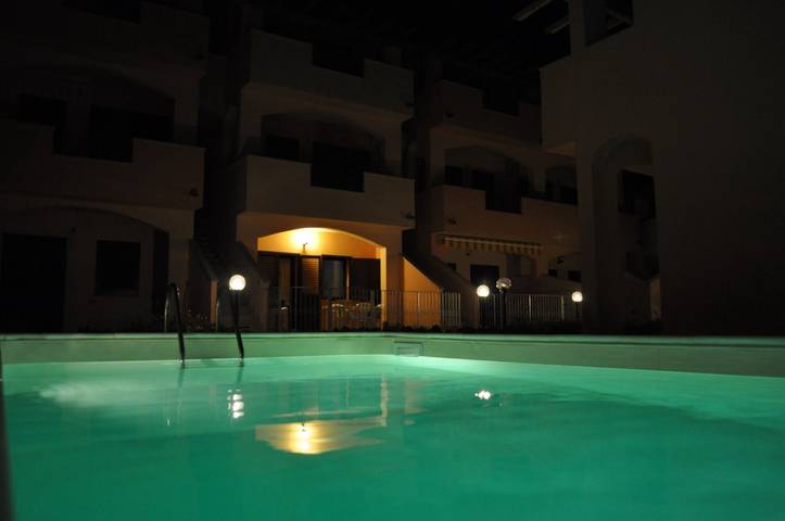 Entire apartment, Apartment 'La Rosa Dei Venti' with Shared Pool and Air Conditioning in Viddalba, Sassari Province