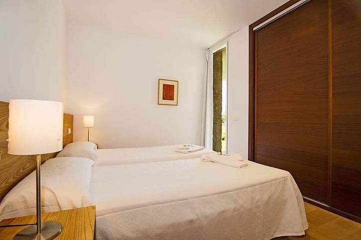 Luxury modern stone clad Villa with swimming pool and mountain views in Port de Pollença, Pollença