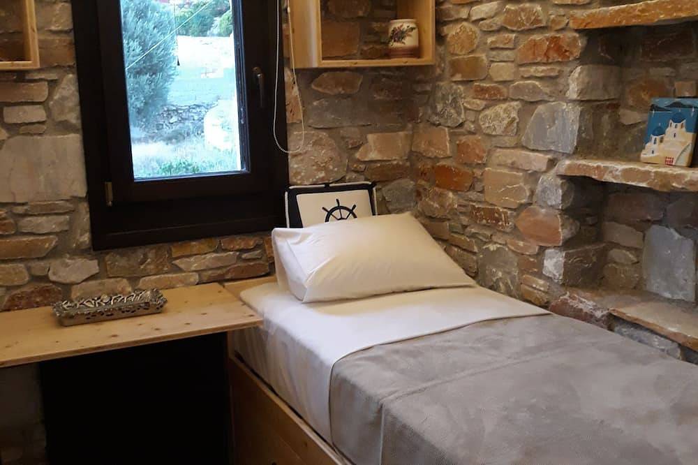 Villa Camellia is a beautiful stone house overlooking the sea. in Poseidonia, Syros