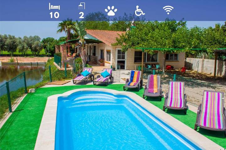 Casa de vacaciones para 10 personas, con jardín además de vistas y vistas al lago, Se admiten mascotas en Delta del Ebro