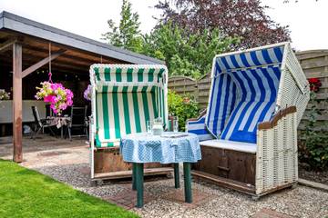 Ferienwohnung 'Ferien Bei Buske' mit Gemeinschaftsterrasse, Privatem Garten und WLAN