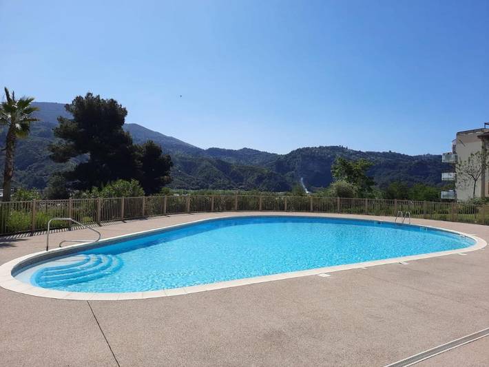 Appartement de vacances pour 4 personnes, avec jardin ainsi que vue et piscine