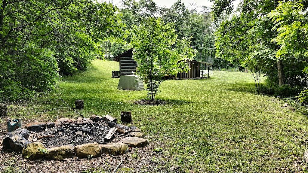Moonshine Cabin with a nice yard on the creek in the shadows of the Smokies in Cocke County