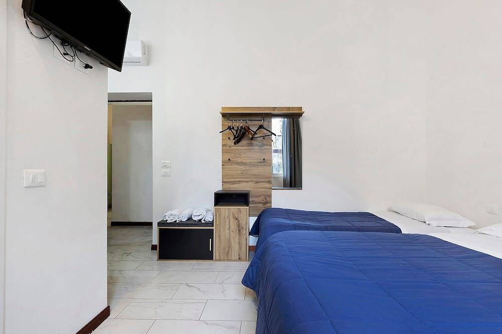 Apartamento entero, Habitación Papavero - Triple con Jardín Compartido, Wi-Fi y Aire Acondicionado in Prato, Provincia de Prato