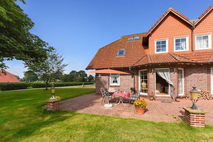 Ferienwohnung für 4 Personen, mit Terrasse und Garten sowie Ausblick in Dunum