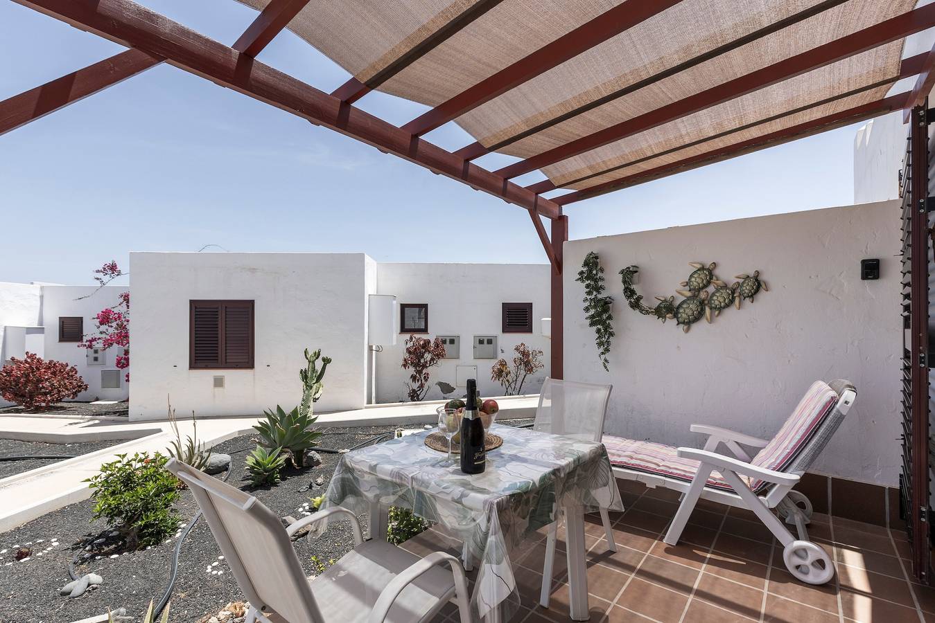 Ferienhaus „Oasis“ mit Gemeinschaftspool, privater Terrasse und Wlan in Caleta de Fuste, Antigua