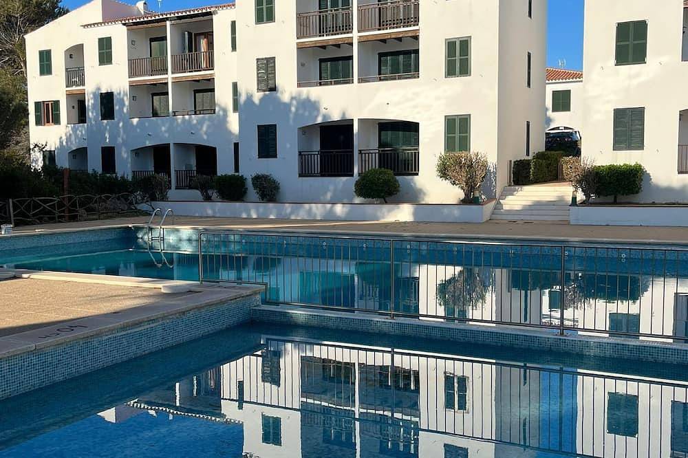 Apartamento entero, Apartamento moderno, 5 min de la playa con piscina in Arenal d'en Castell, Es Mercadal