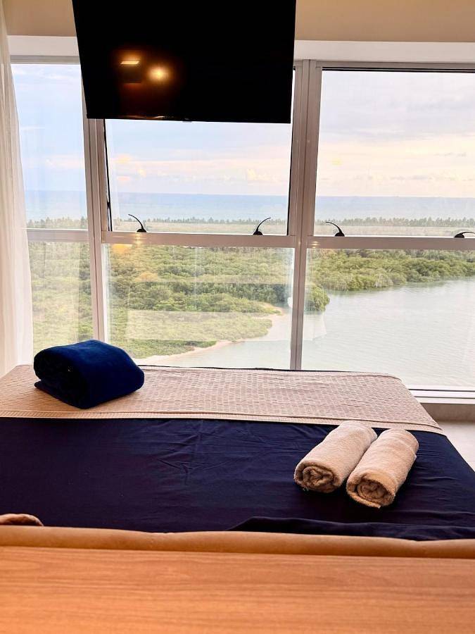 Casas e apartamentos de temporada para 4 pessoas, com vista e piscina na Enseada dos Corais