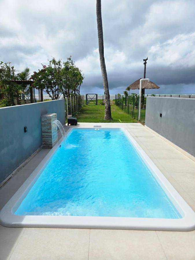 Casas e apartamentos de temporada para 10 pessoas, com piscina e jardim e ainda vista em Ponta do Mangue