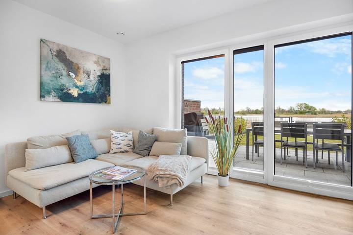 Ferienhaus für 4 Personen, mit Terrasse und Garten sowie Seeblick in Wangerland