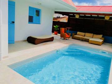 Location de vacances pour 8 personnes, avec piscine ainsi que vue et balcon à Le Carbet