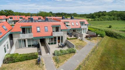 Cottage pour 4 personnes, avec jardin et piscine à De Koog