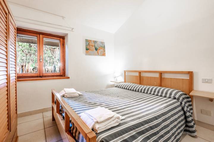 Geheel appartement, Appartement 'La Capannuccia C' met gedeelde tuin, Wifi en airconditioning in Al Cartello, Orbetello