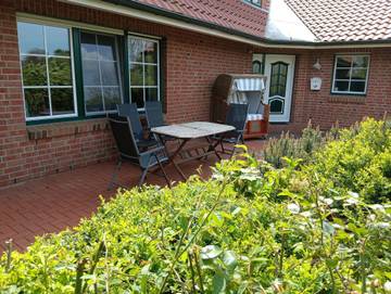 Ferienwohnung für 4 Personen, mit Terrasse und Garten, kinderfreundlich in Krautsand