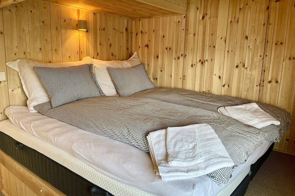 Architect designed sleeping box in barn in Ål