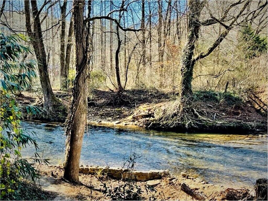 Downtown by Chattahoochee River, sit on front porch as horse and buggy stroll by in Helen, Chattahoochee National Forest