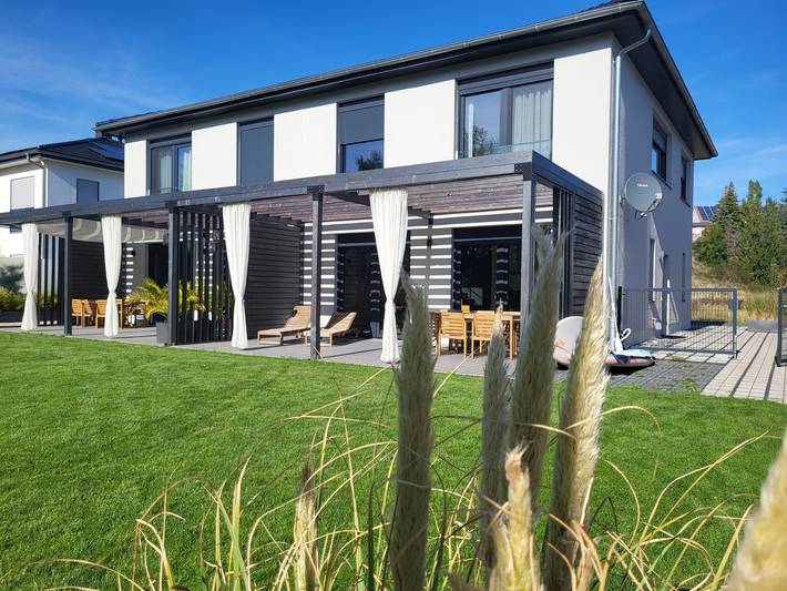 Ferienhaus 'Schlossterrassen 4a' mit Seeblick, privater Terrasse und WLAN in Pouch, Muldestausee