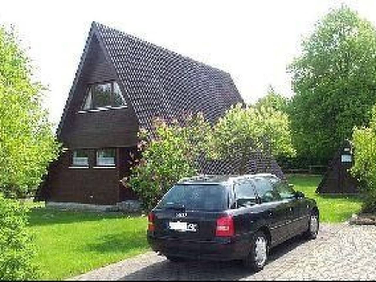 Spitzdachferienhaus mit Schwedenofen und Garten in Ostseebad Damp, Damp