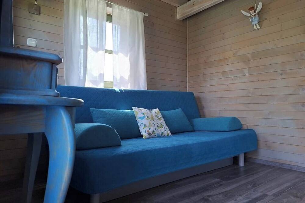 Sommerhaus aus Holzbalken in Mauersee