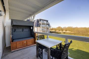 Ferienwohnung für 3 Personen, mit Balkon und Ausblick sowie Sauna in Wremen