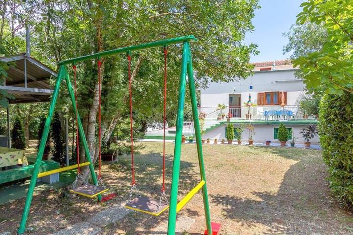 Ferienhaus für 9 Personen, mit Balkon und Terrasse sowie Garten