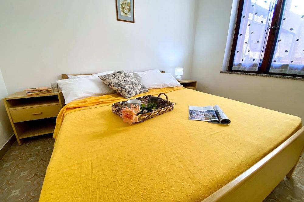 Casa Vacanze con Cortile a 20 Passi Dalla Spiaggia per Famiglie e Gruppi in Sa Rocca Tunda, Sardegna