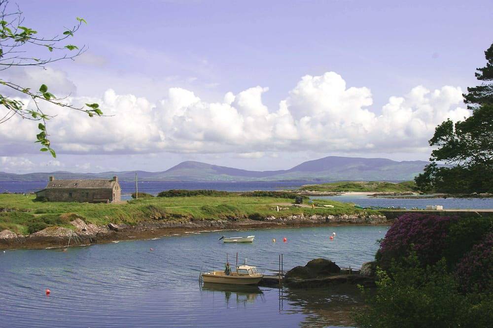 Restored 18th C. Coastguard cottage on shore of beautiful Kenmare Estuary in County Kerry