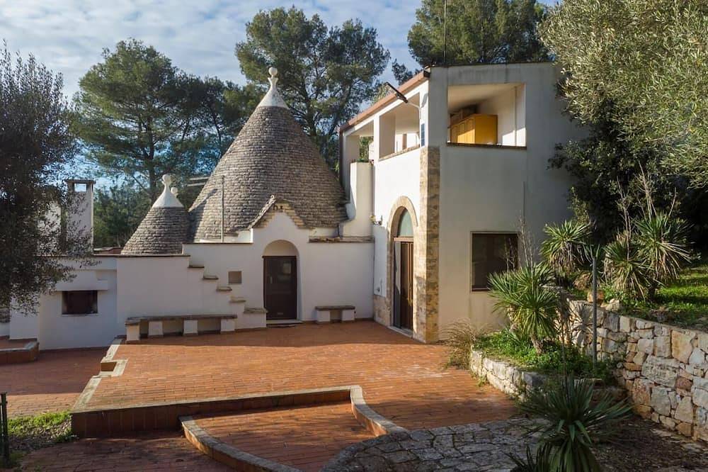 Trulli in the woods of the valley of Itria in Salento