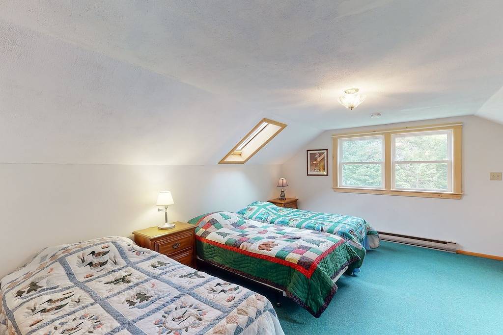 Lakefront home with private dock, mooring, pebble beach, grill, & firepit in Moosehead Lake