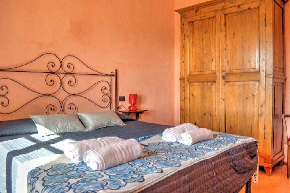 La Capannina with view over the green tuscany hills in Colle di Val d'Elsa, Siena Province