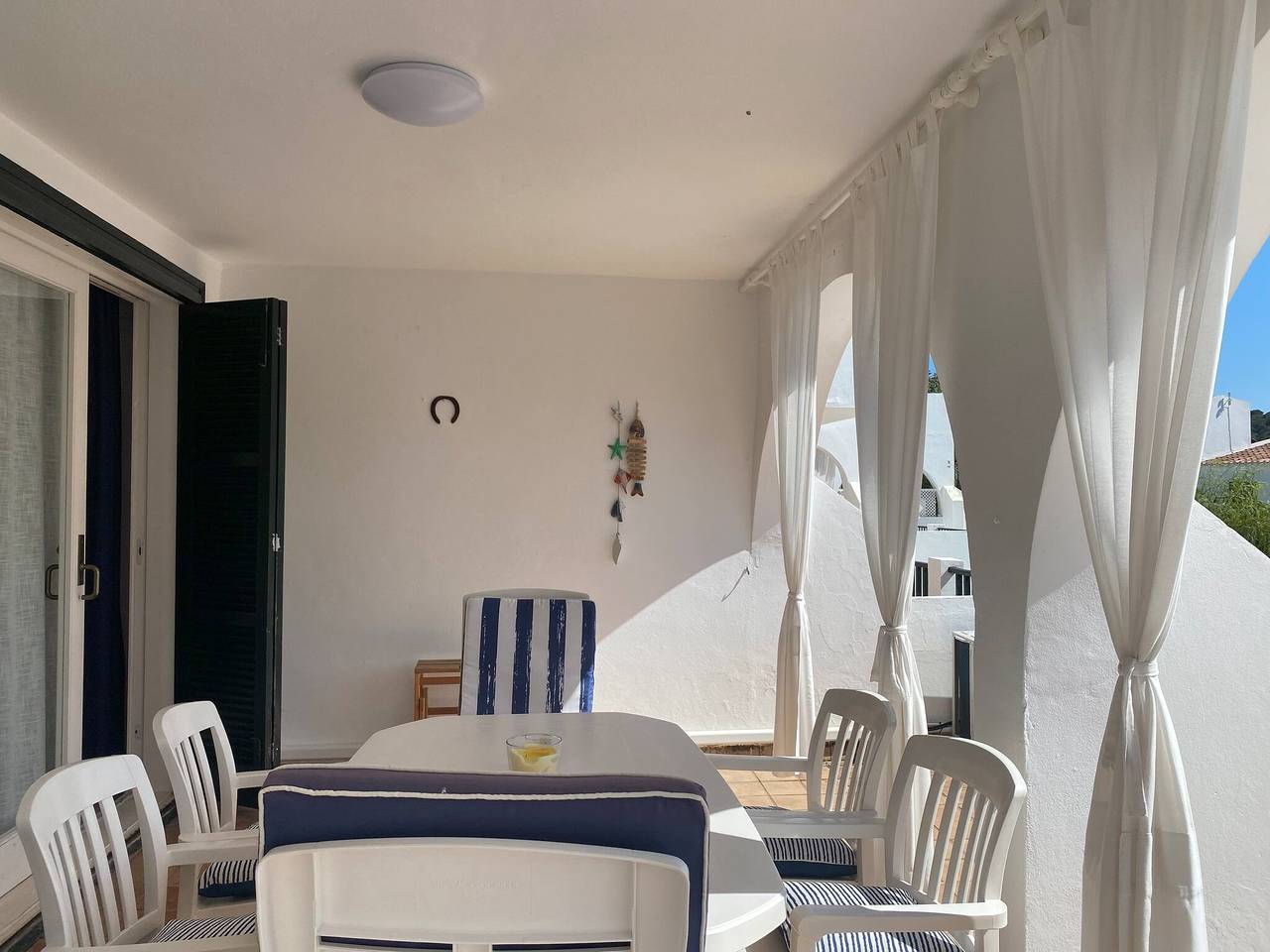 Apartamento entero, Apartamento de vacaciones para 4 personas con jardín in Son Parc, Es Mercadal