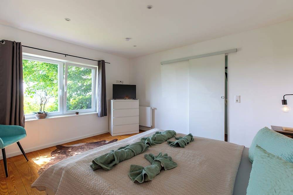 Ferienhaus Ckate Gemütliches Ferienhaus mit Kamin, Sauna & großem Garten in Brokdorf, Kreis Steinburg
