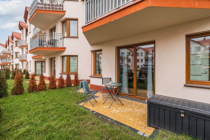 Ganze Wohnung, Comfortable Apartment with Terrace | Close to the Beach, Parking in Darłówko, Darłowo