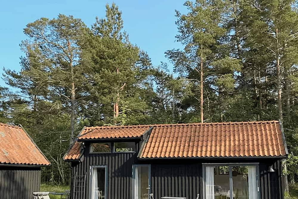 Helles Haus mit Blick auf den Sonnenuntergang über dem Ekeviken auf Fårö in Fårö, Gotland