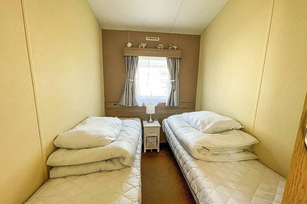 Caravan with large decking at Coopers Beach Holiday Park ref 49036Ts in Mersea Island, Colchester