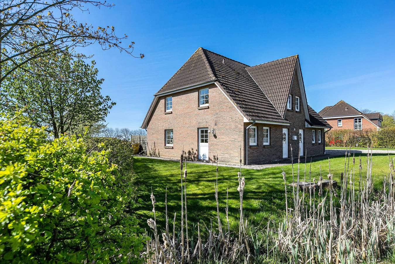 Ferienhaus mit 4 Zimmern, privater Terrasse, Gemeinschaftsgarten und Wlan in Neukirchen (Nordfriesland), Nordfriesland