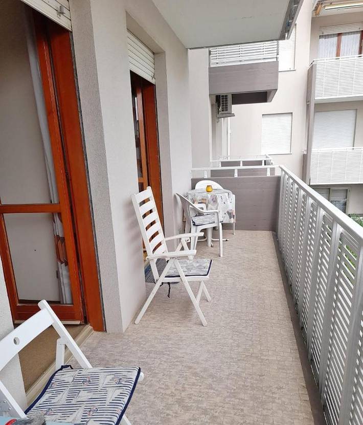 Casa vacanza per 4 persone, con balcone e piscina in Lignano Sabbiadoro