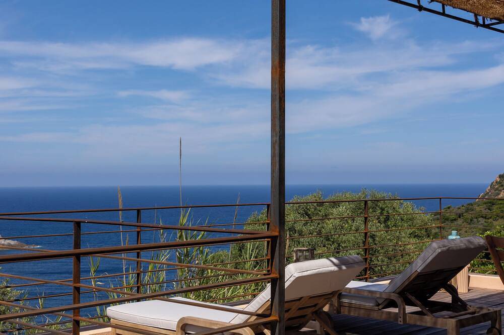 House between sea and scrubland near Arone beach in Piana, Corsica in Piana-Francia, Ajaccio e dintorni