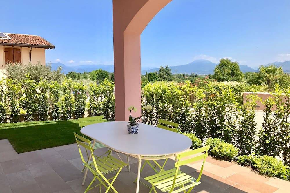 Ganze Wohnung, Helle Wohnung mit einem Schlafzimmer mit Terrasse und Garten in Ponti sul Mincio, Gardasee