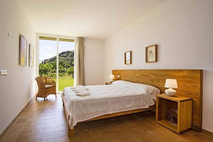 Luxury modern stone clad Villa with swimming pool and mountain views in Port de Pollença, Pollença