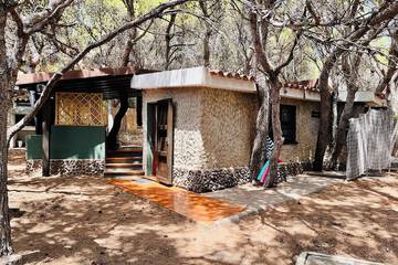 Gîte pour 4 personnes, avec jardin à Porto Pino