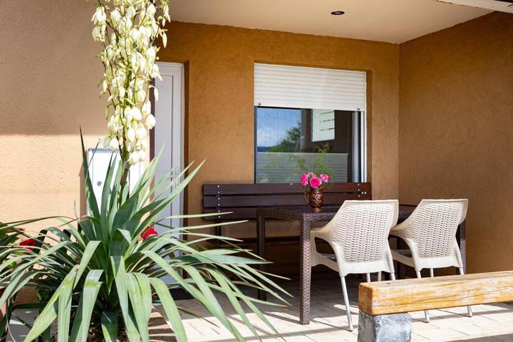 Appartement de vacances pour 5 personnes, avec Terrasse et Jardin ainsi que Vue sur le lac et Vue