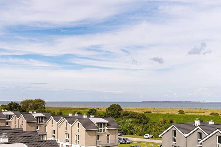 Ferienwohnung mit Meerblick für 4 Personen, mit Balkon und Sauna sowie Seeblick in Schillig, Wangerland
