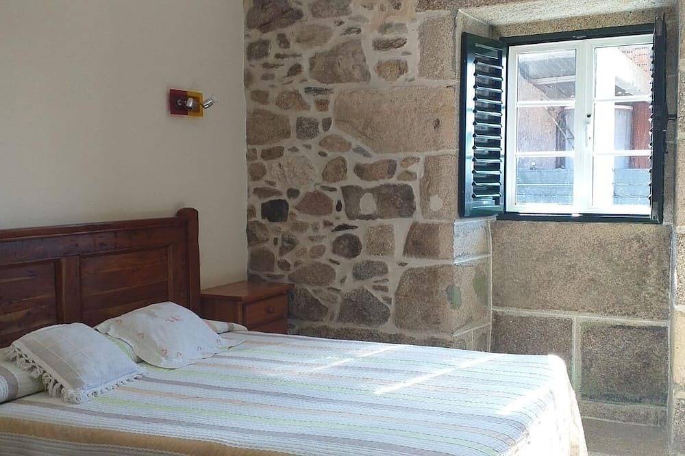 A rustic family home located in a village in Galicia, surrounded by countryside in A Estrada, Pontevedra Province