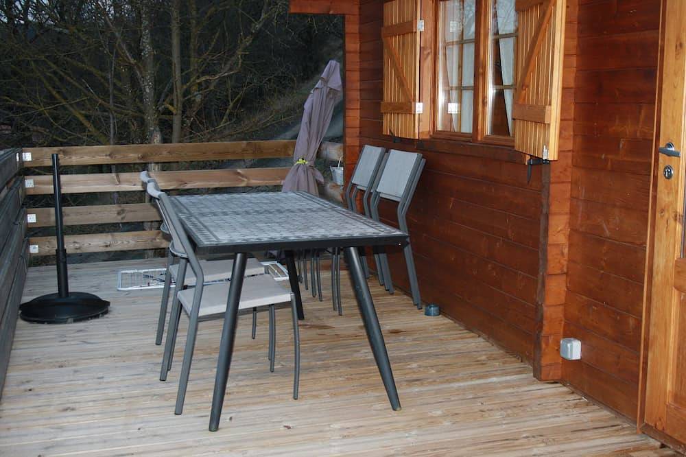 Wooden chalet in the heart of nature near a farm in Neschers, Massif Central