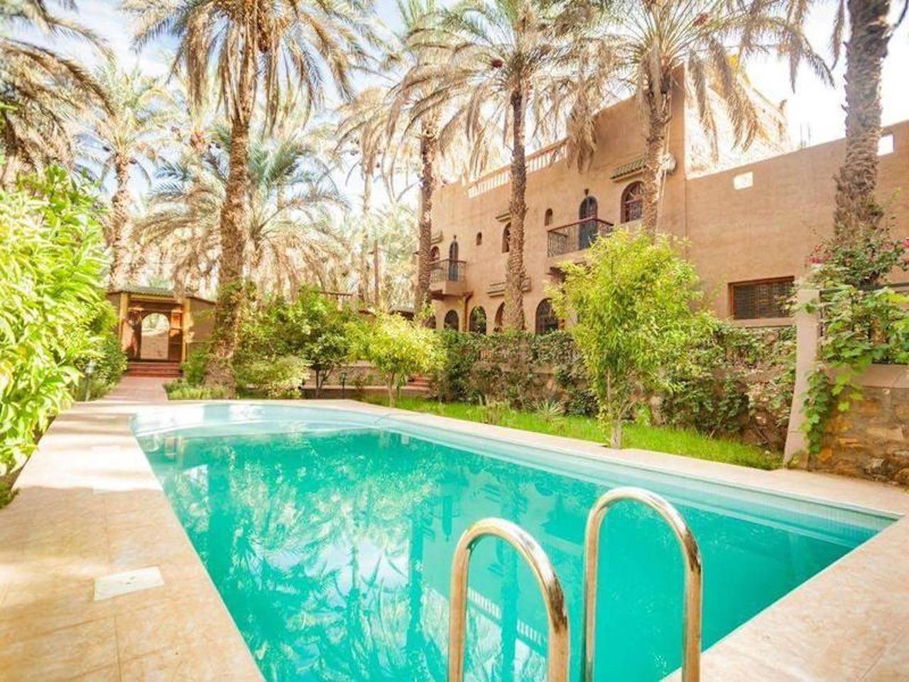 Beautiful kasbah in the middle of an oasis and a calm and peaceful palm grove in Zagora (Morocco), Souss-Massa-Drâa region