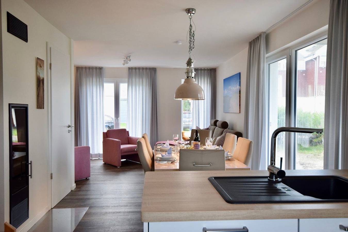 Nordsee-Ferienhaus mit Privatsauna, Kamin, Südterrasse & Balkon mit Meerblick in Schillig Strand, Wangerland
